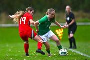 28 September 2024; Kate Jones of Republic of Ireland in action against Lily Nicholls of Cymru during the women's U17 international friendly match between Republic of Ireland and Cymru at the AUL Complex in Clonsaugh, Dublin. Photo by Shauna Clinton/Sportsfile