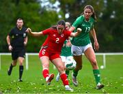 28 September 2024; Mia Davies of Cymru in action against Mary Hartofolis of Republic of Ireland during the women's U17 international friendly match between Republic of Ireland and Cymru at the AUL Complex in Clonsaugh, Dublin. Photo by Shauna Clinton/Sportsfile