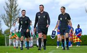 28 September 2024; Match officials lead out both teams before the Cerebal Palsy women's international series match between Ireland and USA at the AUL Complex in Dublin. Photo by Shauna Clinton/Sportsfile