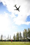 27 September 2024; A general view of the action as a plane comes into land at Dublin Airport during the cerebal palsy women's international series match between Ireland and Denmark at the AUL Complex in Dublin. Photo by Stephen McCarthy/Sportsfile