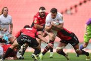28 September 2024; Jacob Stockdale of Ulster is tackled by Franco Marais and Darrien Landsberg of Emirates Lions during the United Rugby Championship match between Emirates Lions and Ulster at Emirates Airline Park in Johannesburg, South Africa. Photo by Shaun Roy/Sportsfile
