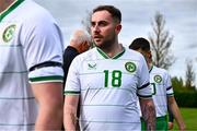 28 September 2024; Carl McKee of Ireland lines up to shake hands with match officials before the Cerebal Palsy men's international series match between Ireland and Scotland at the AUL Complex in Dublin. Photo by Shauna Clinton/Sportsfile