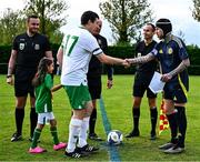 28 September 2024; Ireland captain Joseph Markey and Scotland captain Jon McFarlane shake hands before the Cerebal Palsy men's international series match between Ireland and Scotland at the AUL Complex in Dublin. Photo by Shauna Clinton/Sportsfile