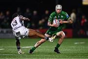 28 September 2024; Mack Hansen of Connacht avoids the tackle of Jurenzo Julius of Hollywoodbets Sharks during the United Rugby Championship match between Connacht and Hollywoodbets Sharks at Dexcom Stadium in Galway. Photo by Tyler Miller/Sportsfile