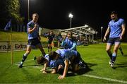 28 September 2024; Roy Lawlor of UCD, bottom, celebrates with team mates after scoring their side's second goal during the EA SPORTS MU20 League of Ireland Enda McGuill Cup final match between UCD and Sligo Rovers at UCD Bowl in Belfield, Dublin. Photo by David Fitzgerald/Sportsfile