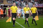 28 September 2024; Match officials, from left, assistant referee Dylan Redmond, referee Ryan Maher and assistant referee Niall McLoughlin before the SSE Airtricity Women's Premier Division match between Galway United and Shelbourne at Eamonn Deacy Park in Galway. Photo by Stephen McCarthy/Sportsfile