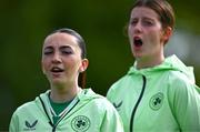 28 September 2024; Republic of Ireland players, including Ella Kelly, left, stand for the national anthem before the women's U17 international friendly match between Republic of Ireland and Cymru at the AUL Complex in Clonsaugh, Dublin. Photo by Shauna Clinton/Sportsfile