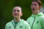 28 September 2024; Republic of Ireland players, including Ella Kelly, left, stand for the national anthem before the women's U17 international friendly match between Republic of Ireland and Cymru at the AUL Complex in Clonsaugh, Dublin. Photo by Shauna Clinton/Sportsfile