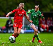 28 September 2024; Ella Kelly of Republic of Ireland in action against Annie Davies of Cymru during the women's U17 international friendly match between Republic of Ireland and Cymru at the AUL Complex in Clonsaugh, Dublin. Photo by Shauna Clinton/Sportsfile