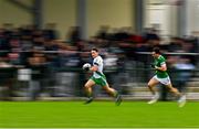 29 September 2024; Colm Harnett of Sarsfields breaks clear from Evan O'Brien of Moorefield during the Kildare County Senior Club Football Championship quarter-final match between Moorefield and Sarsfields at Manguard Park Hawkfield in Newbridge, Kildare. Photo by Tyler Miller/Sportsfile