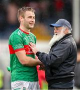 29 September 2024; John McGrath of Loughmore-Castleiney is congratulated by a supporter after the Tipperary County Senior Club Hurling Championship semi-final match between Loughmore Castleiney and Thurles Sarsfields at FBD Semple Stadium in Thurles, Tipperary. Photo by Michael P Ryan/Sportsfile