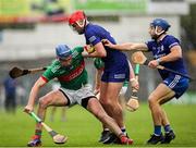 29 September 2024; John McGrath of Loughmore-Castleiney in action against Thurles Sarsfields players James Armstrong, centre, and Paul Maher during the Tipperary County Senior Club Hurling Championship semi-final match between Loughmore Castleiney and Thurles Sarsfields at FBD Semple Stadium in Thurles, Tipperary. Photo by Michael P Ryan/Sportsfile