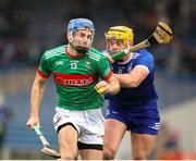 29 September 2024; John McGrath of Loughmore-Castleiney in action against Ronan Maher of Thurles Sarsfields during the Tipperary County Senior Club Hurling Championship semi-final match between Loughmore Castleiney and Thurles Sarsfields at FBD Semple Stadium in Thurles, Tipperary. Photo by Michael P Ryan/Sportsfile