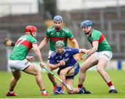 29 September 2024; Stephen Cahill of Thurles Sarsfields in action against Loughmore Castleiney players, from left, Ciaran McCormack, John McGrath, and Joey Hennessy during the Tipperary County Senior Club Hurling Championship semi-final match between Loughmore Castleiney and Thurles Sarsfields at FBD Semple Stadium in Thurles, Tipperary. Photo by Michael P Ryan/Sportsfile