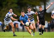 29 September 2024; Paul Lambert of Westport is tackled by Conor Melly, left and Davitt Neary of Breaffy during the Mayo County Senior Club Football Championship quarter-final match between Breaffy and Westport at Breaffy in Mayo. Photo by Tom Beary/Sportsfile