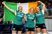 29 September 2024; Ireland players, from left, Eve Higgins, Niamh O’Dowd and Fiona Tuite celebrate after the WXV1 Pool match between New Zealand and Ireland at BC Place in Vancouver, British Columbia. Photo by Rich Lam / World Rugby via Sportsfile