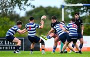29 September 2024; Sean Walsh of Corinthians kicks clear despite the tackle of Thomas Eggers of Blackrock during the Bank of Ireland JP Fanagan Premier 1 qualifiers final match between Corinthians RFC and Blackrock College RFC at Corinthians RFC in Galway. Photo by Shauna Clinton/Sportsfile