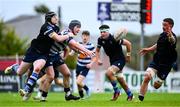 29 September 2024; Harry Casey of Blackrock offloads the ball despite the tackle of Harry Sheridan of Corinthians during the Bank of Ireland JP Fanagan Premier 1 qualifiers final match between Corinthians RFC and Blackrock College RFC at Corinthians RFC in Galway. Photo by Shauna Clinton/Sportsfile