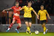 30 September 2024; Tom Grivosti of St Patrick's Athletic in action against Aiden O'Brien of Shelbourne during the SSE Airtricity Men's Premier Division match between Shelbourne and St Patrick's Athletic at Tolka Park in Dublin. Photo by Stephen McCarthy/Sportsfile
