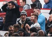 30 September 2024; Dublin gaelic footballer and Shelbourne supporters Brian Fenton, left, and Jack McCaffrey celebrate their side's second goal during the SSE Airtricity Men's Premier Division match between Shelbourne and St Patrick's Athletic at Tolka Park in Dublin. Photo by Stephen McCarthy/Sportsfile