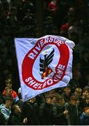 30 September 2024; Shelbourne supporters fly a flag on the Riverside Terrace during the SSE Airtricity Men's Premier Division match between Shelbourne and St Patrick's Athletic at Tolka Park in Dublin. Photo by Stephen McCarthy/Sportsfile