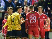 30 September 2024; Referee Damien MacGraith speaks to Joe Redmond of St Patrick's Athletic and Paddy Barrett of Shelbourne during the SSE Airtricity Men's Premier Division match between Shelbourne and St Patrick's Athletic at Tolka Park in Dublin. Photo by Stephen McCarthy/Sportsfile
