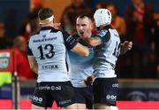 4 October 2024; Peter Dooley of Connacht, centre, celebrates with team-mates Cathal Forde and Mack Hansen after the United Rugby Championship match between Scarlets and Connacht at Parc Y Scarlets in Llanelli, Wales. Photo by Gareth Everett/Sportsfile