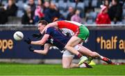 5 October 2024; Peadar Ó Cofaigh Byrne of Cuala is tackled by Dean Rock of Ballymun Kickhams during the Dublin County Senior Club Football Championship semi-final match between Ballymun Kickhams and Cuala at Parnell Park in Dublin. Photo by Ben McShane/Sportsfile