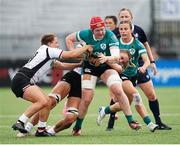 5 October 2024; Aoife Wafer of Ireland is tackled by Caroline Crossley and Justine Pelletier of Canada during the Women's WXV1 Rugby International Pool match between Canada and Ireland at Langley Events Centre in Vancouver, Canada. Photo by Rich Lam / World Rugby via Sportsfile