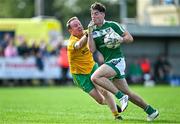 6 October 2024; Evan Harkin of Mohill in action against Liam Ferguson of Ballinamore Sean O'Heslins during the Leitrim County Senior Club Football Championship final match between Ballinamore Sean O'Heslins and Mohill at Ballinamore Sean O'Heslins GAA Club in Leitrim. Photo by Sam Barnes/Sportsfile
