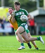 6 October 2024; Evan Harkin of Mohill in action against Liam Ferguson of Ballinamore Sean O'Heslins during the Leitrim County Senior Club Football Championship final match between Ballinamore Sean O'Heslins and Mohill at Ballinamore Sean O'Heslins GAA Club in Leitrim. Photo by Sam Barnes/Sportsfile