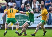 6 October 2024; Sean Harkin of Mohill in action against Wayne McKeon, left, and Liam Ferguson of Ballinamore Sean O'Heslins during the Leitrim County Senior Club Football Championship final match between Ballinamore Sean O'Heslins and Mohill at Ballinamore Sean O'Heslins GAA Club in Leitrim. Photo by Sam Barnes/Sportsfile