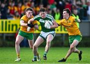 6 October 2024; Tadhg Mulligan of Mohill in action against Michael McBrien, left, and Tom Prior of Ballinamore Sean O'Heslins during the Leitrim County Senior Club Football Championship final match between Ballinamore Sean O'Heslins and Mohill at Ballinamore Sean O'Heslins GAA Club in Leitrim. Photo by Sam Barnes/Sportsfile