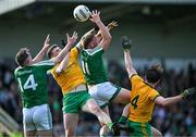 6 October 2024; Keith Keegan, 11, and Keith Beirne, 14, both of Mohill, contest a high ball with Michael McBrien, centre, and Patrick Connaughton, right, both of Ballinamore Sean O'Heslins during the Leitrim County Senior Club Football Championship final match between Ballinamore Sean O'Heslins and Mohill at Ballinamore Sean O'Heslins GAA Club in Leitrim. Photo by Sam Barnes/Sportsfile