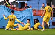 6 October 2024; Aaron Dobbs of Wexford, centre, celebrates with teammates after scoring their side's first goal during the Sports Direct Men’s FAI Cup semi-final match between Drogheda United and Wexford at Weavers Park in Drogheda, Louth. Photo by Ben McShane/Sportsfile