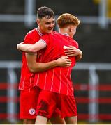 6 October 2024; Aaron Keogh of Shelbourne, right, celebrates with team-mate Dan Ring after scoring their side's third goal during the EA SPORTS MU17 LOI Mark Farren Cup match between Shelbourne and Kerry FC at Tolka Park in Dublin. Photo by Tyler Miller/Sportsfile