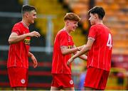 6 October 2024; Aaron Keogh of Shelbourne, centre, celebrates with team-mates Dan Ring, left, and Taylor McCarthy after scoring their side's third goal during the EA SPORTS MU17 LOI Mark Farren Cup match between Shelbourne and Kerry FC at Tolka Park in Dublin. Photo by Tyler Miller/Sportsfile