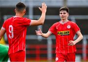 6 October 2024; Alex Flynn of Shelbourne, right, celebrates with team-mate Dan Ring after scoring their side's fourth goal during the EA SPORTS MU17 LOI Mark Farren Cup match between Shelbourne and Kerry FC at Tolka Park in Dublin. Photo by Tyler Miller/Sportsfile