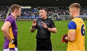 6 October 2024; From left, Paul Mannion of Kilmacud Crokes, referee Darren Delaney and Johnny Cooper of Na Fianna before the Dublin County Senior Club Football Championship semi-final match between Kilmacud Crokes and Na Fianna at Parnell Park in Dublin. Photo by Stephen Marken/Sportsfile