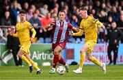 6 October 2024; Douglas James-Taylor of Drogheda United in action against Cian O'Malley of Wexford during the Sports Direct Men’s FAI Cup semi-final match between Drogheda United and Wexford at Weavers Park in Drogheda, Louth. Photo by Ben McShane/Sportsfile