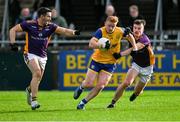 6 October 2024; Conor McHugh of Na Fianna in action against Shane Walsh,left, and Michael Mullin of Kilmacud Crokes during the Dublin County Senior Club Football Championship semi-final match between Kilmacud Crokes and Na Fianna at Parnell Park in Dublin. Photo by Stephen Marken/Sportsfile