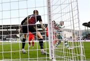 6 October 2024; Jack Byrne of Shamrock Rovers, right, scores his side's first goal, past Shelbourne goalkeeper Conor Kearns, during the SSE Airtricity Men's Premier Division match between Shamrock Rovers and Shelbourne at Tallaght Stadium in Dublin. Photo by Seb Daly/Sportsfile
