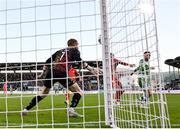 6 October 2024; Jack Byrne of Shamrock Rovers, right, scores his side's first goal, past Shelbourne goalkeeper Conor Kearns, during the SSE Airtricity Men's Premier Division match between Shamrock Rovers and Shelbourne at Tallaght Stadium in Dublin. Photo by Seb Daly/Sportsfile