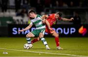 6 October 2024; Josh Honohan of Shamrock Rovers in action against John O'Sullivan of Shelbourne during the SSE Airtricity Men's Premier Division match between Shamrock Rovers and Shelbourne at Tallaght Stadium in Dublin. Photo by Seb Daly/Sportsfile