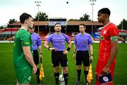6 October 2024; Referee Eric Eaton performs the coin toss alongside team captains Cian Beirne of Kerry FC and Raymond Offor of Shelbourne before the EA SPORTS MU17 LOI Mark Farren Cup match between Shelbourne and Kerry FC at Tolka Park in Dublin. Photo by Tyler Miller/Sportsfile