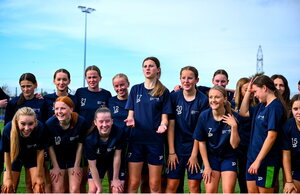 7 October 2024; Kassie McLaughlin, centre, tries to convince programme co-ordinator Megan Smyth-Lynch to join the group photograph during the FAI/ Fingal Girls' TY Course at TUD in Blanchardstown, Dublin. Photo by Shauna Clinton/Sportsfile