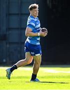 7 October 2024; Josh van der Flier warms up with an American football during a Leinster rugby squad training session at UCD in Dublin. Photo by Piaras Ó Mídheach/Sportsfile