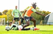 7 October 2024; Festy Ebosele is tackled by Andrew Omobamidele, left, during a Republic of Ireland training session at the FAI National Training Centre in Abbotstown, Dublin. Photo by Stephen McCarthy/Sportsfile