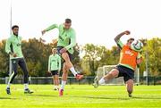 7 October 2024; Evan Ferguson in action against Sammie Szmodics, rigth, and Andrew Omobamidele, left, during a Republic of Ireland training session at the FAI National Training Centre in Abbotstown, Dublin. Photo by Stephen McCarthy/Sportsfile