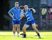 7 October 2024; Josh van der Flier warms up with an American football during a Leinster rugby squad training session at UCD in Dublin. Photo by Piaras Ó Mídheach/Sportsfile